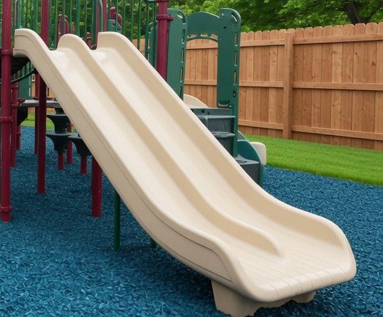 Slide landing on blue rubber mulch