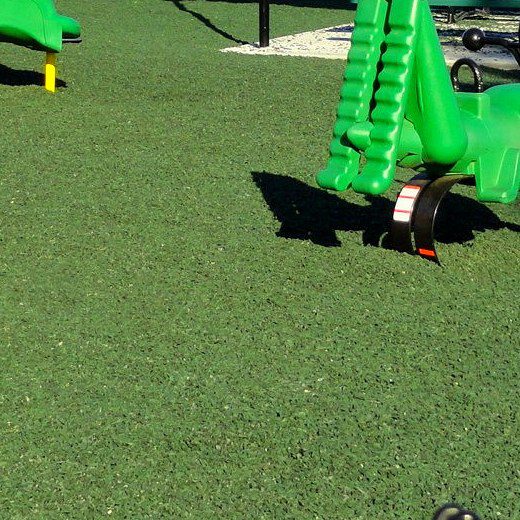 Spring rider on green rubber mulch