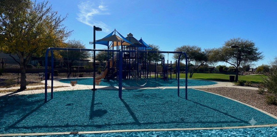Blue rubber mulch at a park playground