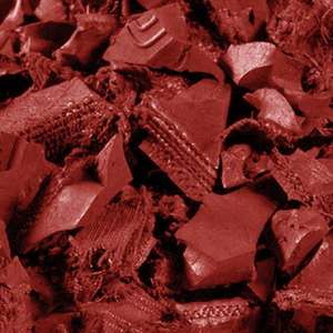Close-up of vibrant red rubber mulch holding its color