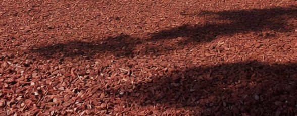 Close view of redwood rubber mulch surface