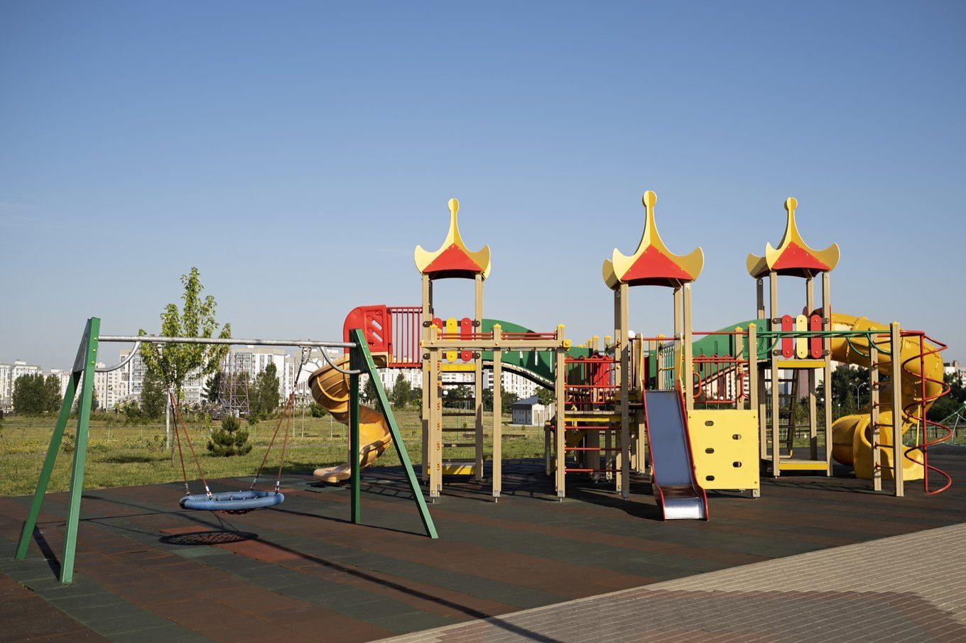 Themed play structures on a rubber mulch safety surface