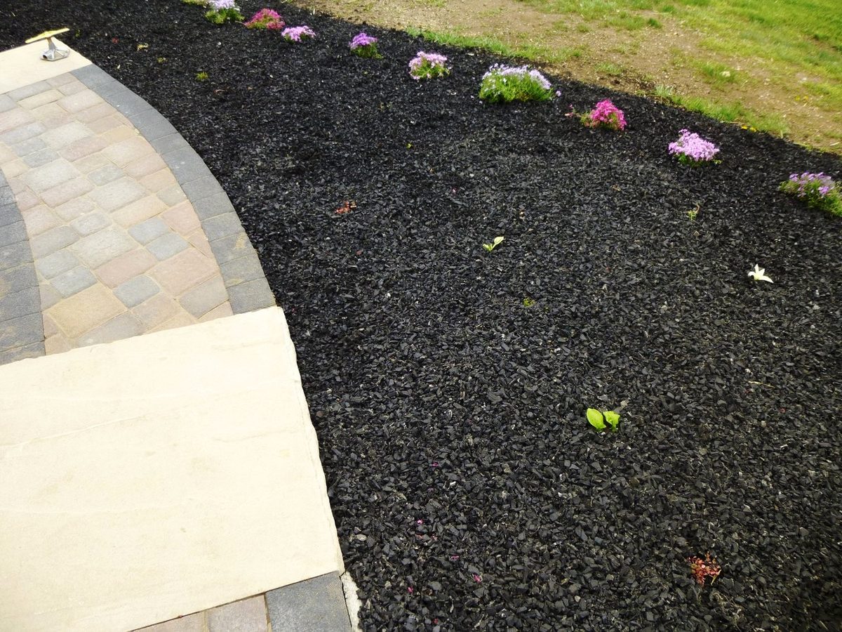 Rubber mulch in a Montana landscape bed