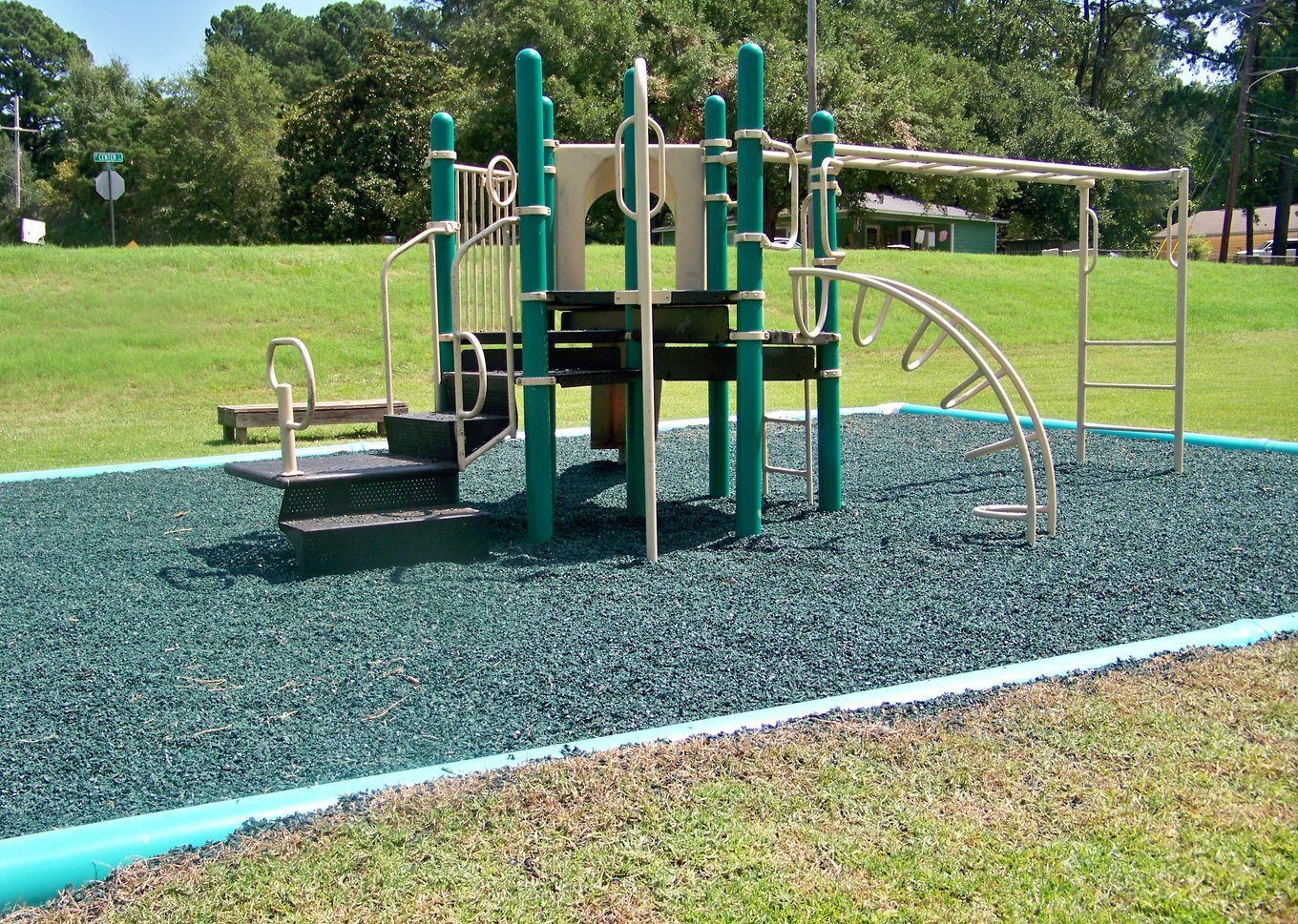 Rubber mulch as a fall surface under park playground equipment
