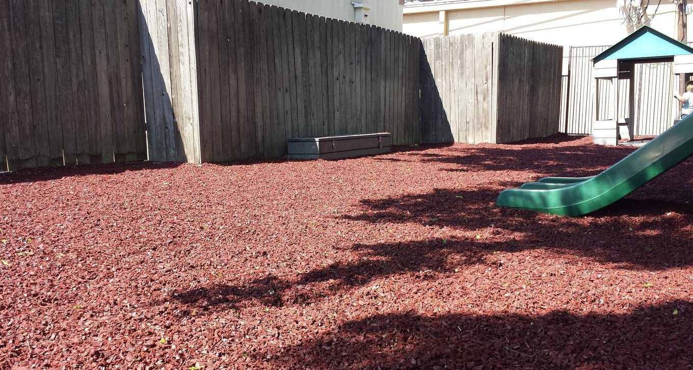 Rubber mulch as a fall surface under park playground equipment