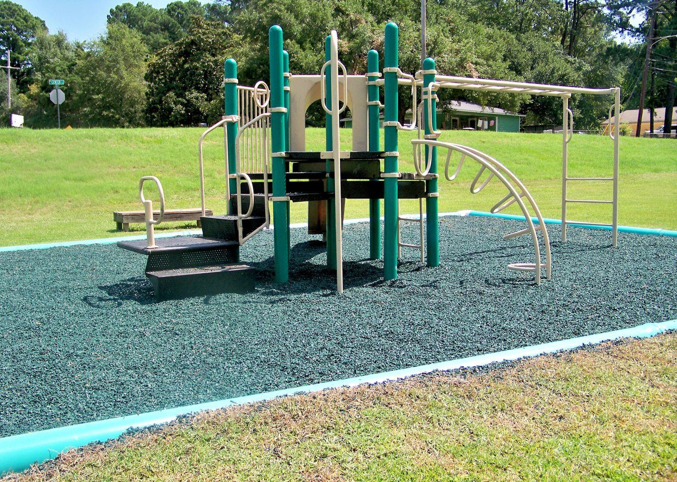 Rubber mulch as a fall surface under park playground equipment