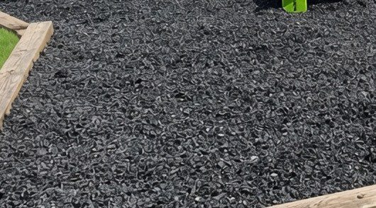 Close view of unpainted rubber mulch surface