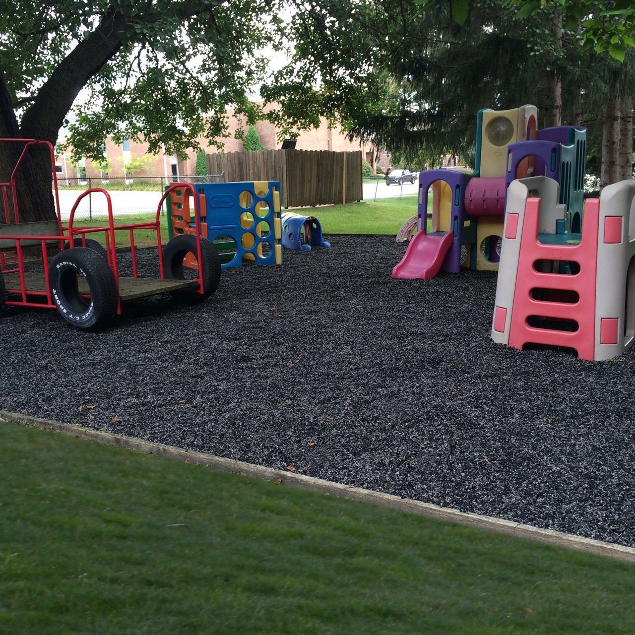 Daycare play equipment on a rubber mulch surface
