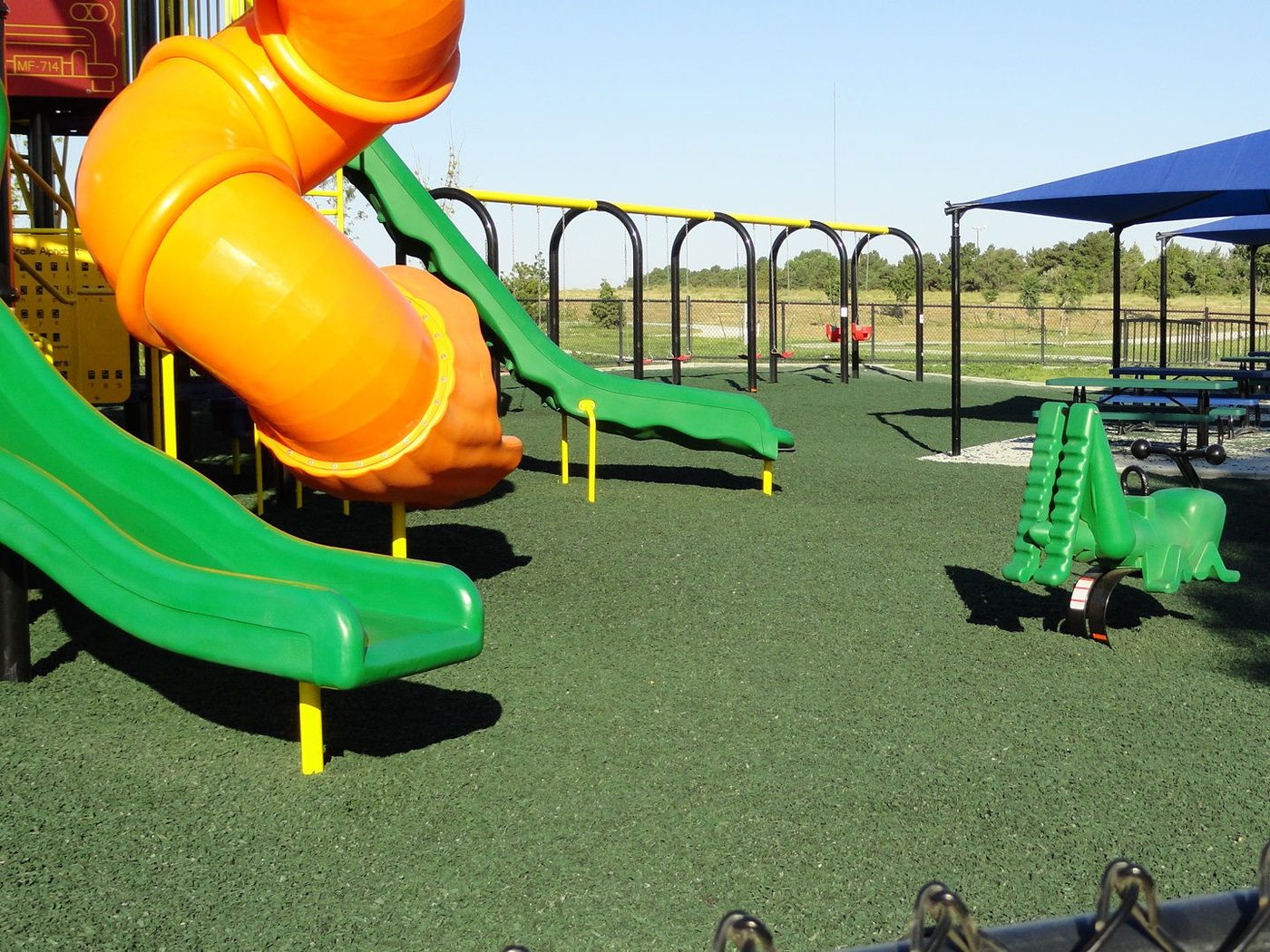 School play structure on a rubber mulch safety surface
